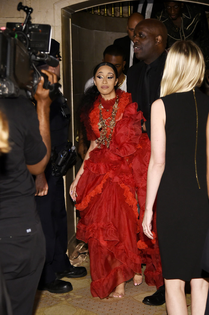 Cardi B exiting the Harper's Bazaar party after having an altercation with Nicki Minaj [Credit: Instyle]