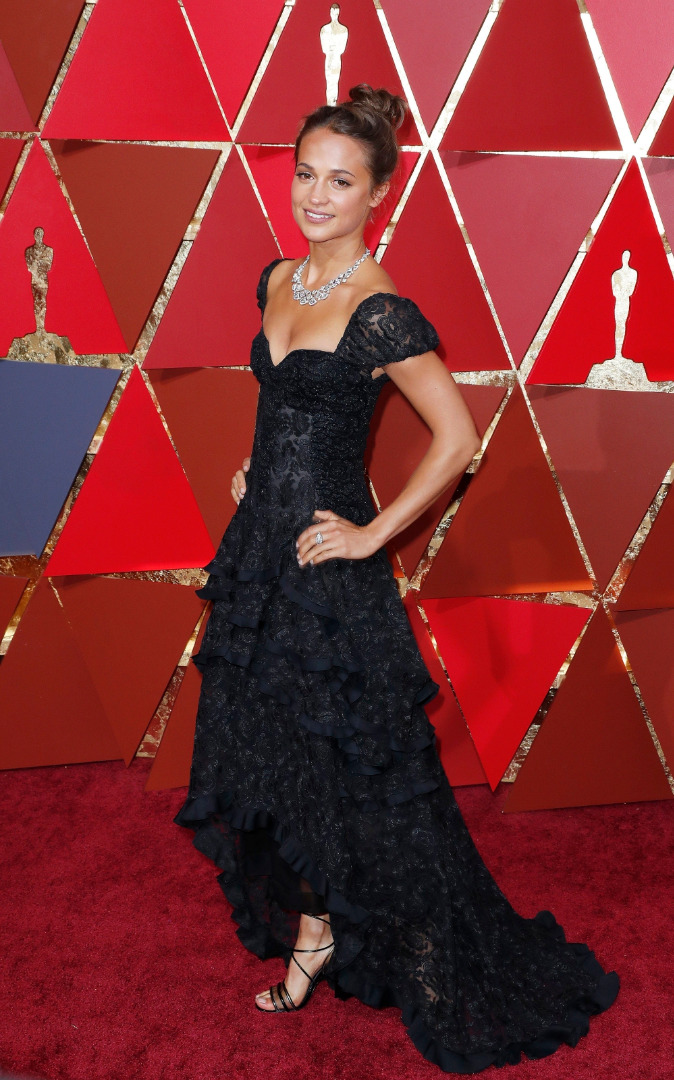 W sukni Louis Vuitton.