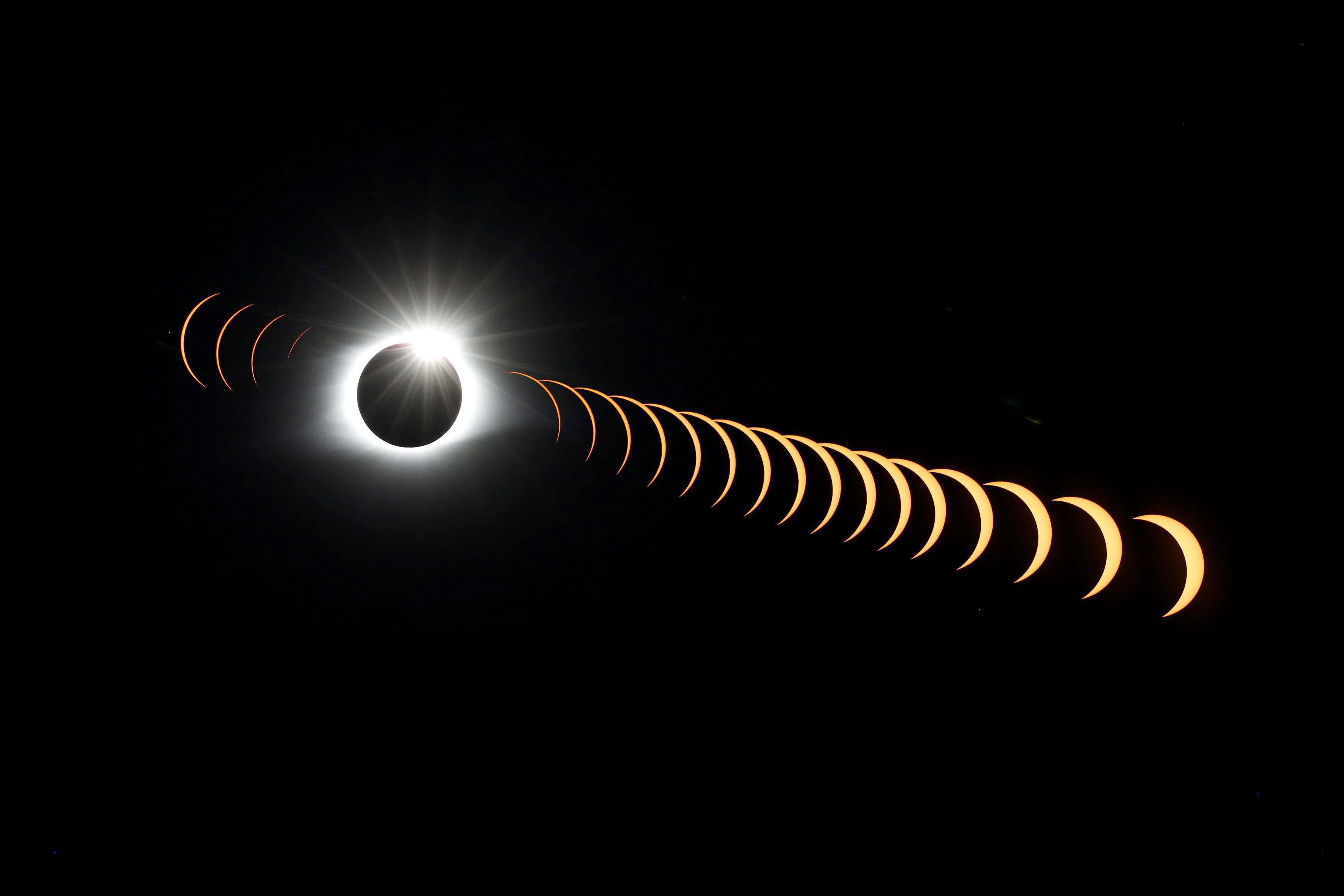 A composite image of 21 separate photographs taken with a single fixed camera shows the solar eclips