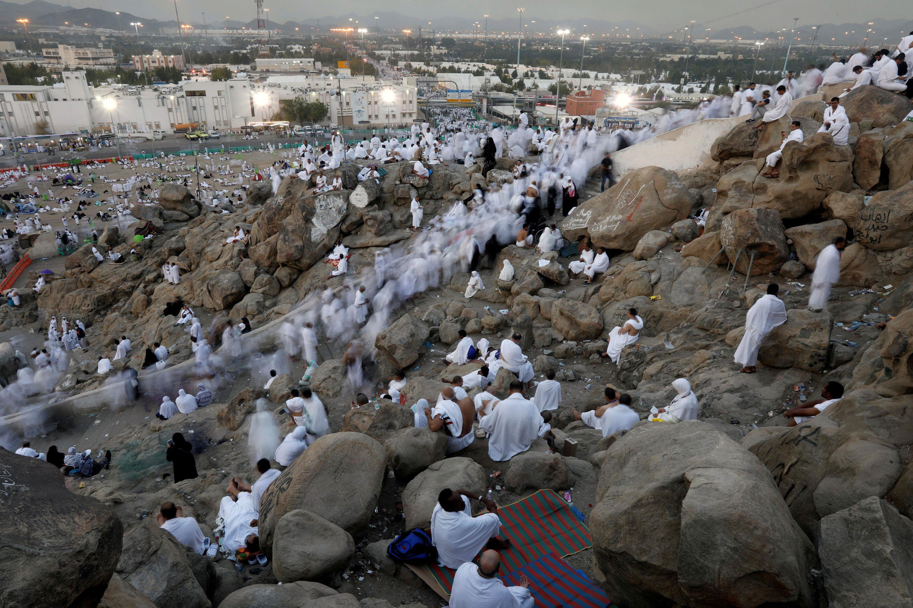 Muslim pilgrims gather on Mount Mercy on the plains of Arafat during the annual haj pilgrimage, outs