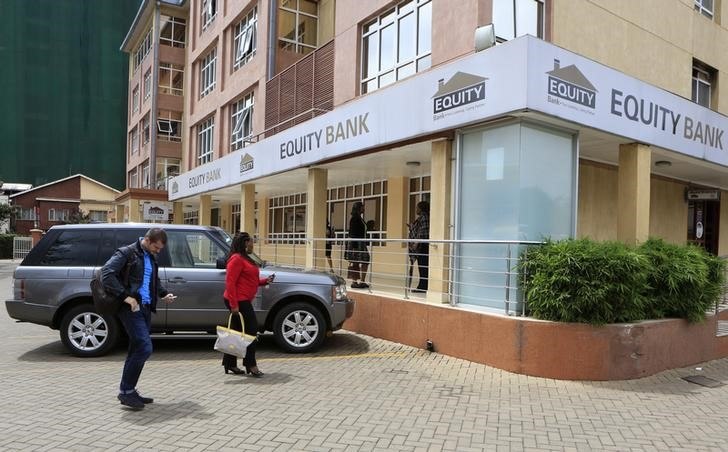 Customers arrive at a branch of the Equity Bank for money transactions in Kenya's capital Nairobi November 11, 2015. 