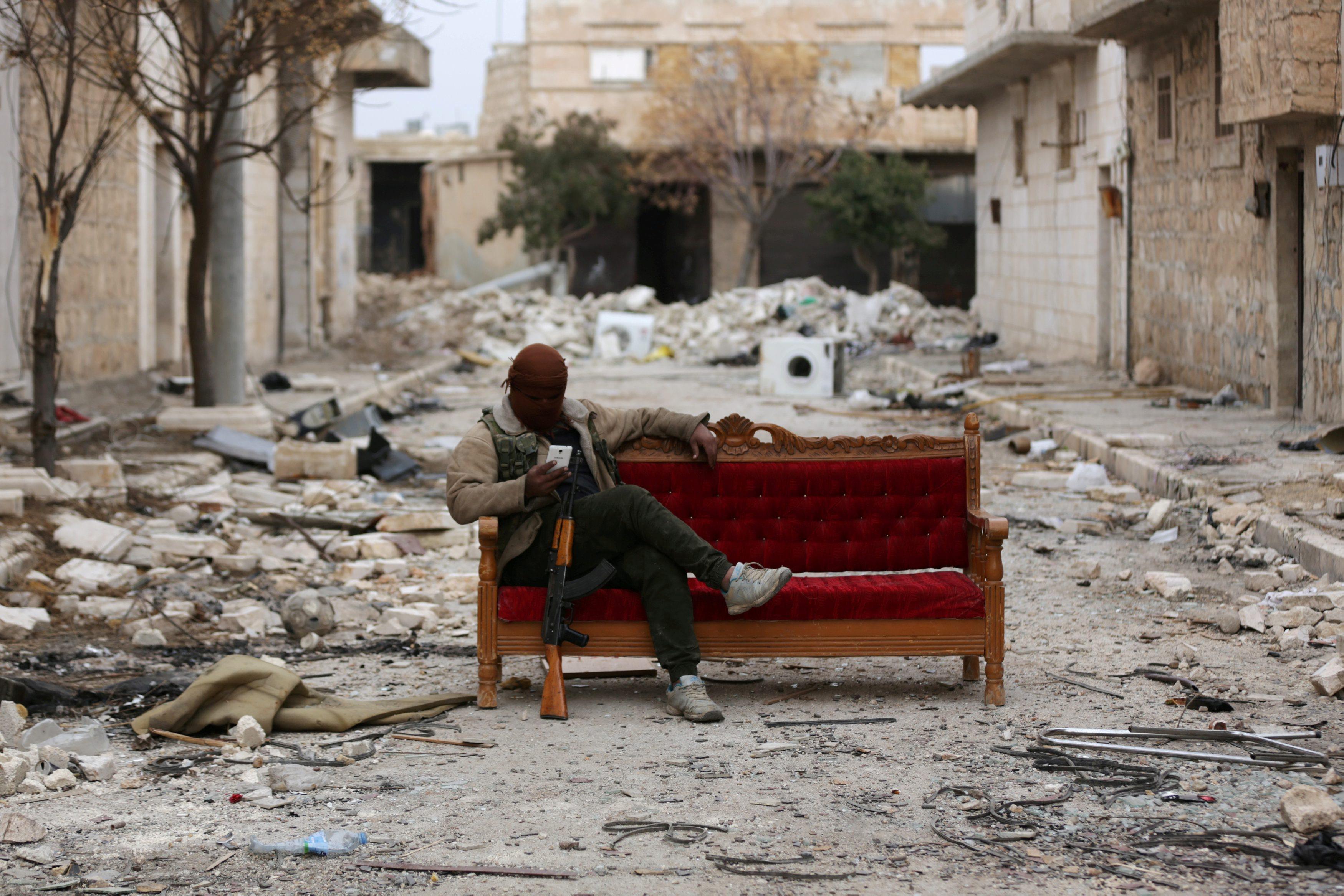 A Turkey-backed Free Syrian Army fighter is seen in the eastern suburbs of al Bab