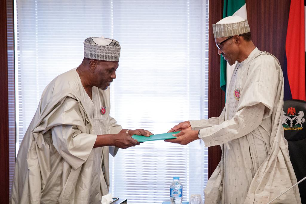 President Muhammadu Buhari receives the report of the Presidential Review Panel on National Intelligence Agency (NIA) from former Minister of Foreign Affairs, Ambassador Babagana Kingibe at the Presidential Villa on Tuesday, December 19, 2017 (Presidency) 