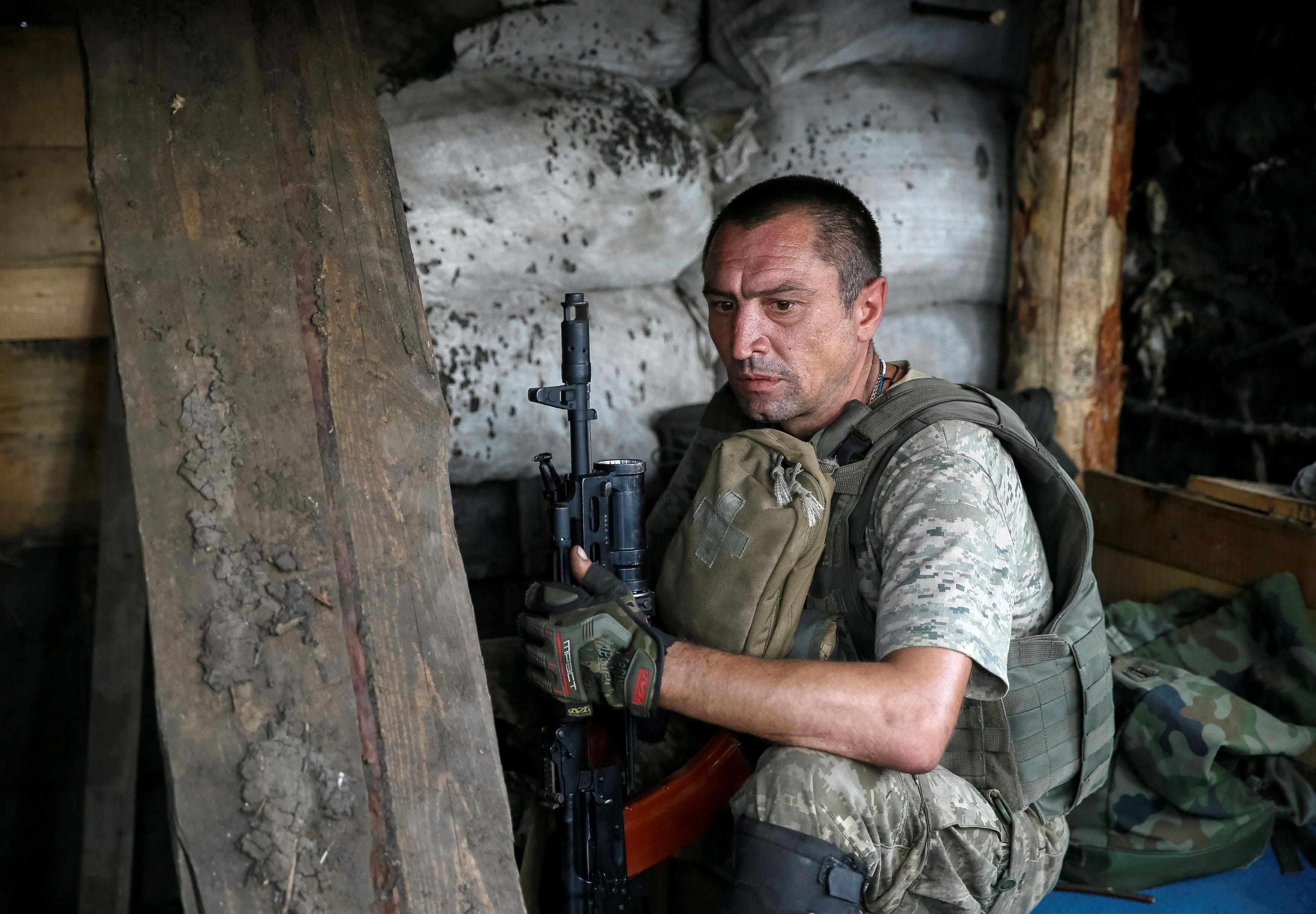 Ukrainian serviceman is seen at his position on the front line in Krasnogorovka