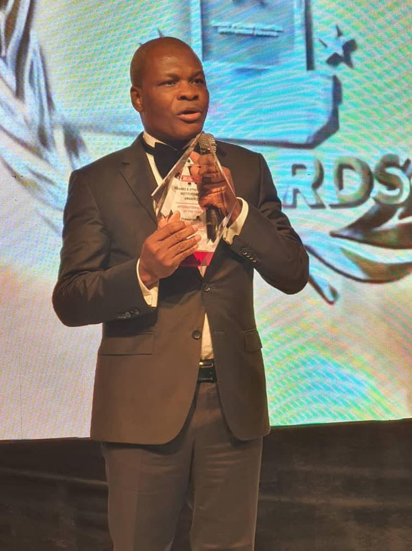 Deputy Managing Director, Ayo Liadi with the Bank of the Year Award won by UBA at the BusinessDay Bank and other Financial Institutions Award (BAFI), held in Lagos at the weekend.