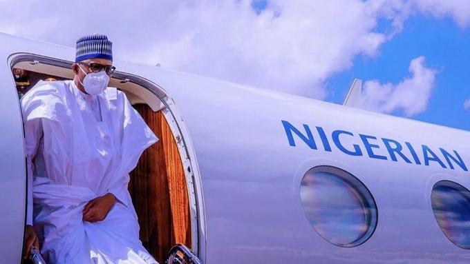 President Muhammadu Buhari steps into Abuja after peace mission in Mali.  Healthcare workers in his city haven't been paid for months [Twitter@ToluOgunlesi]