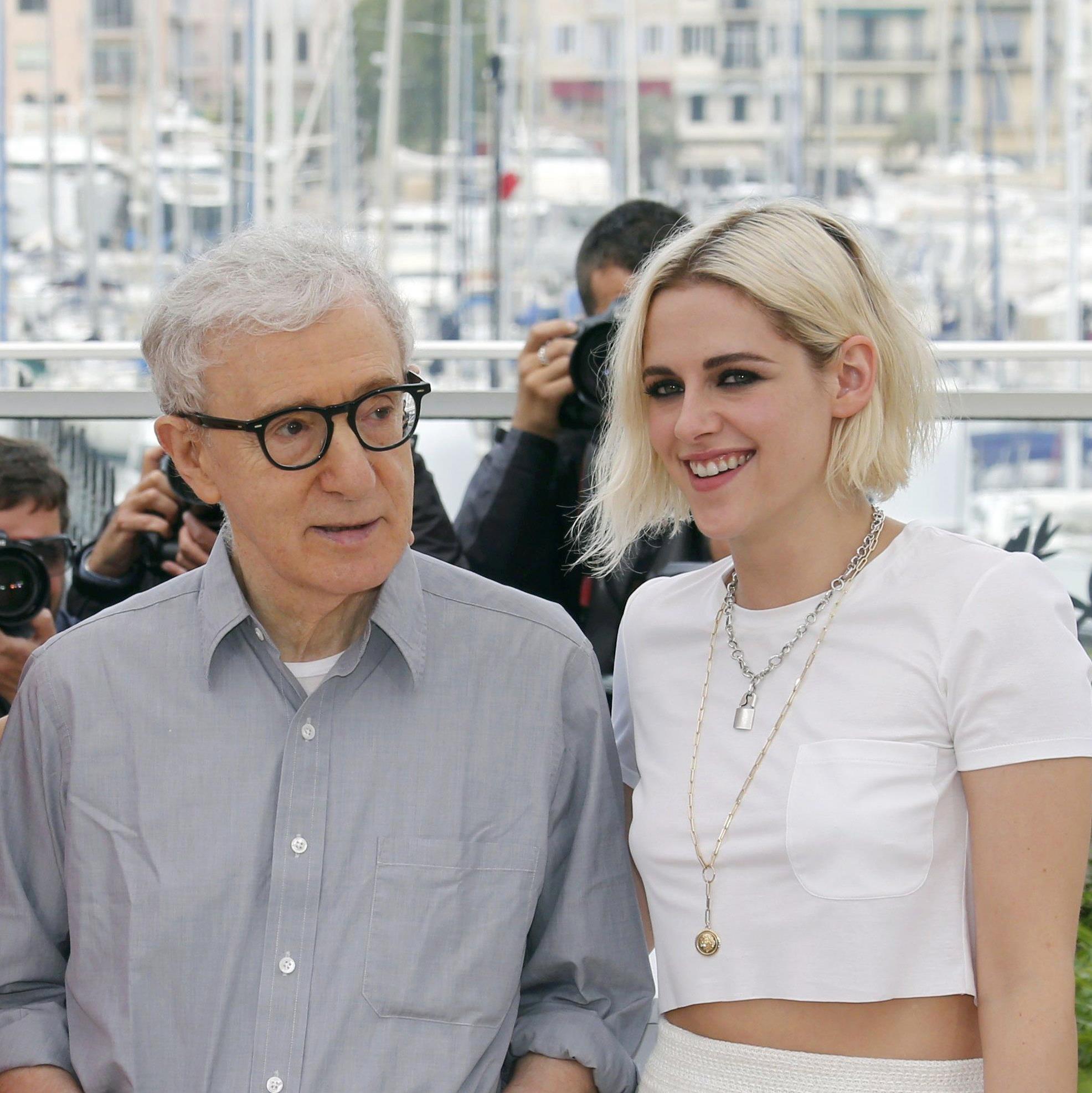 Actress Blake Lively jokes with director Woody Allen and actress Kristen Stewart as they pose during a photocall for the film 