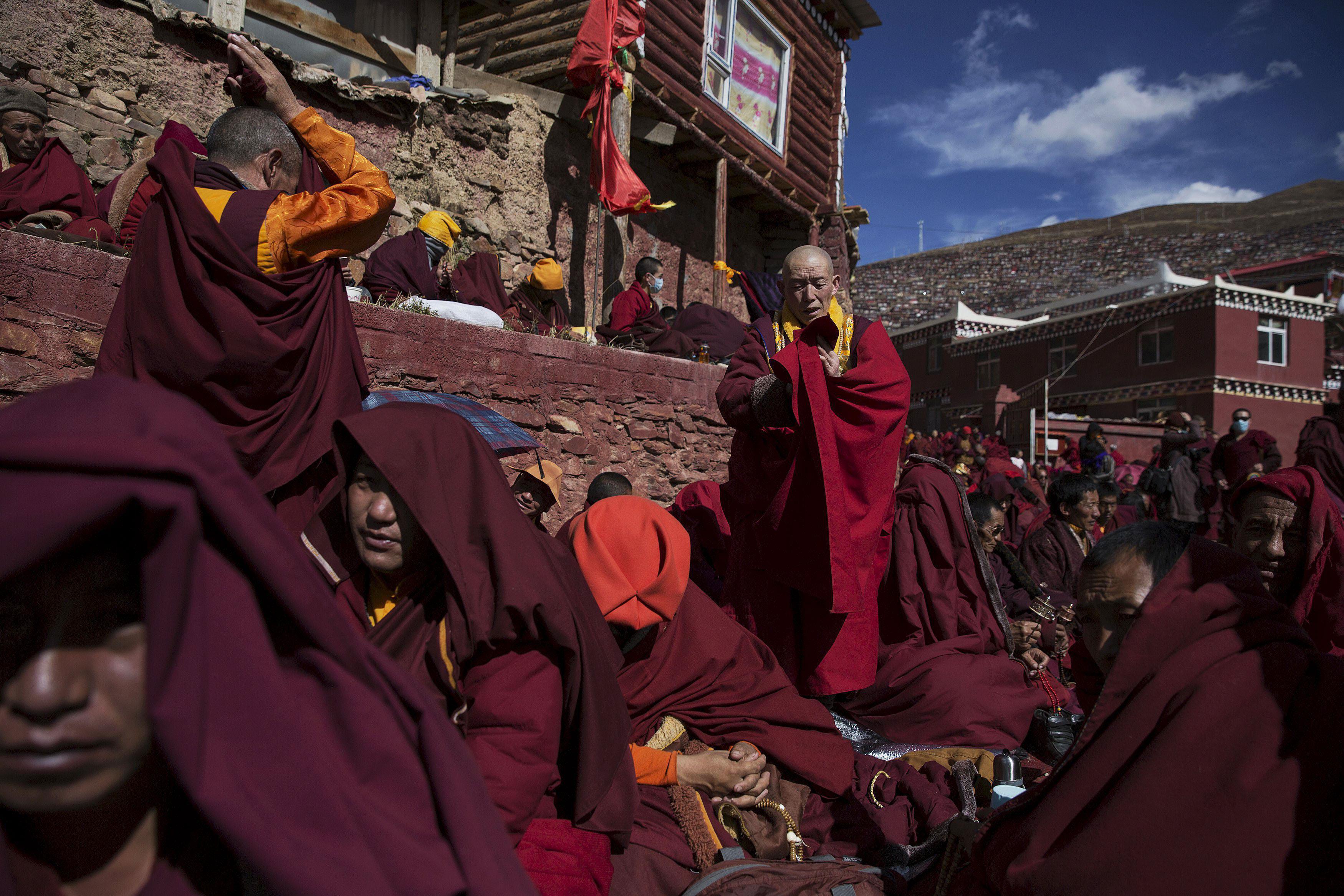 Tibetan Buddhist monks pray at Buddhist laymen lodge during the Utmost Bliss Dharma Assembly in remo