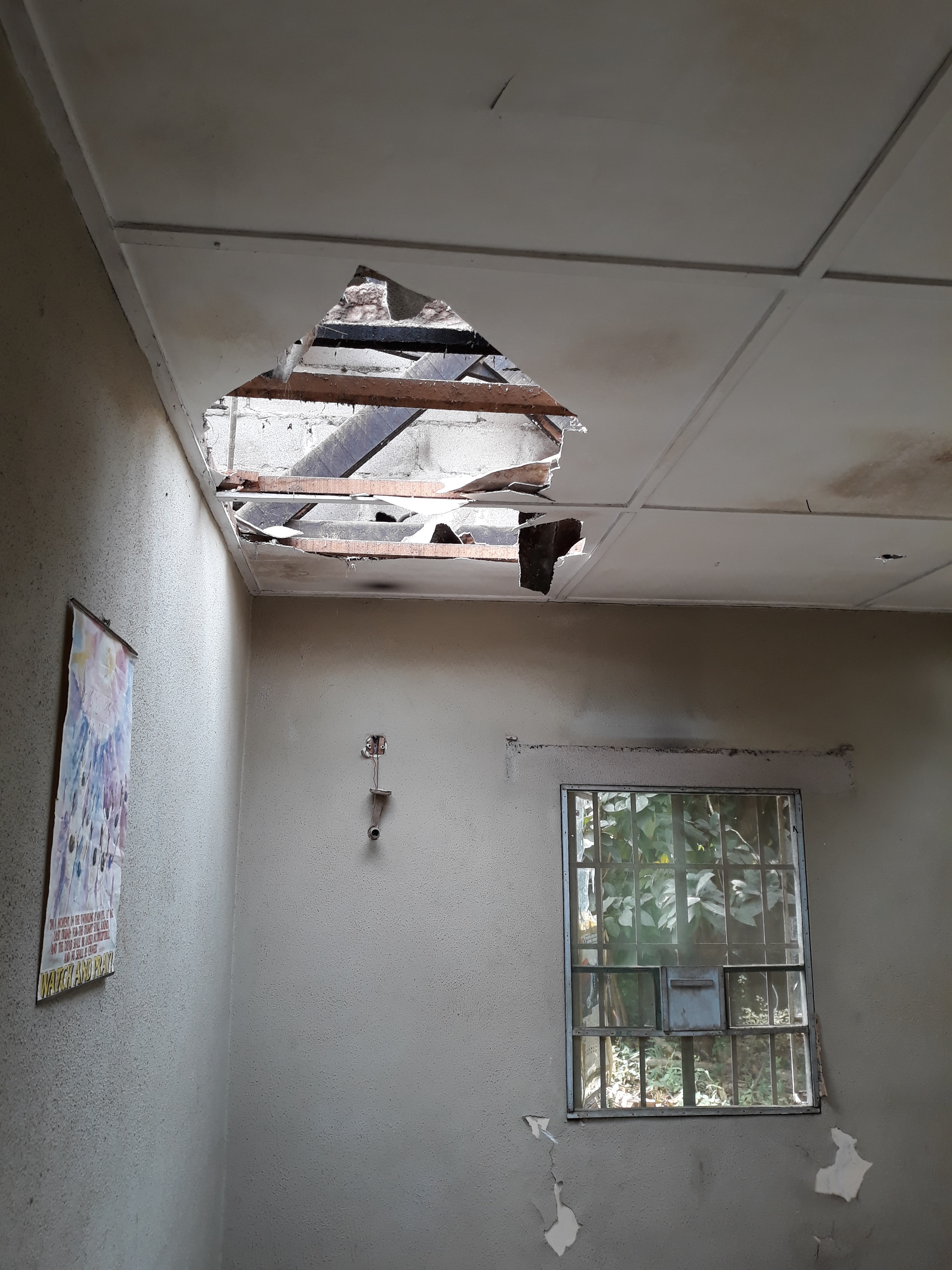 There were several holes punctured in the ceiling of the Obidike home (Credit: Pulse)