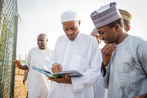 President Muhammadu Buhari and his son Yusuf, during a visit to the President's farm in Daura, Katsina State.