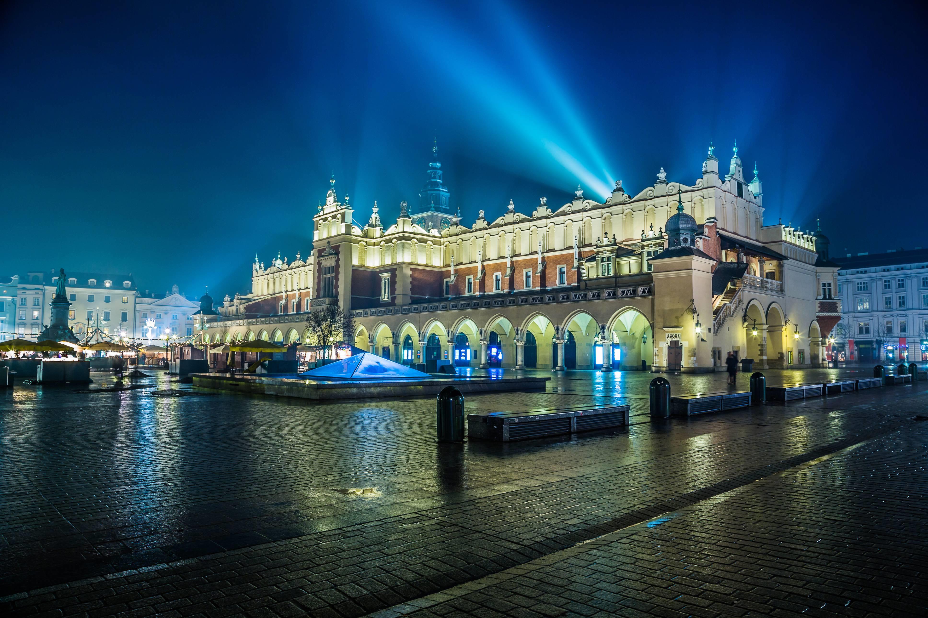 Poland, Krakow. Market Square at night.