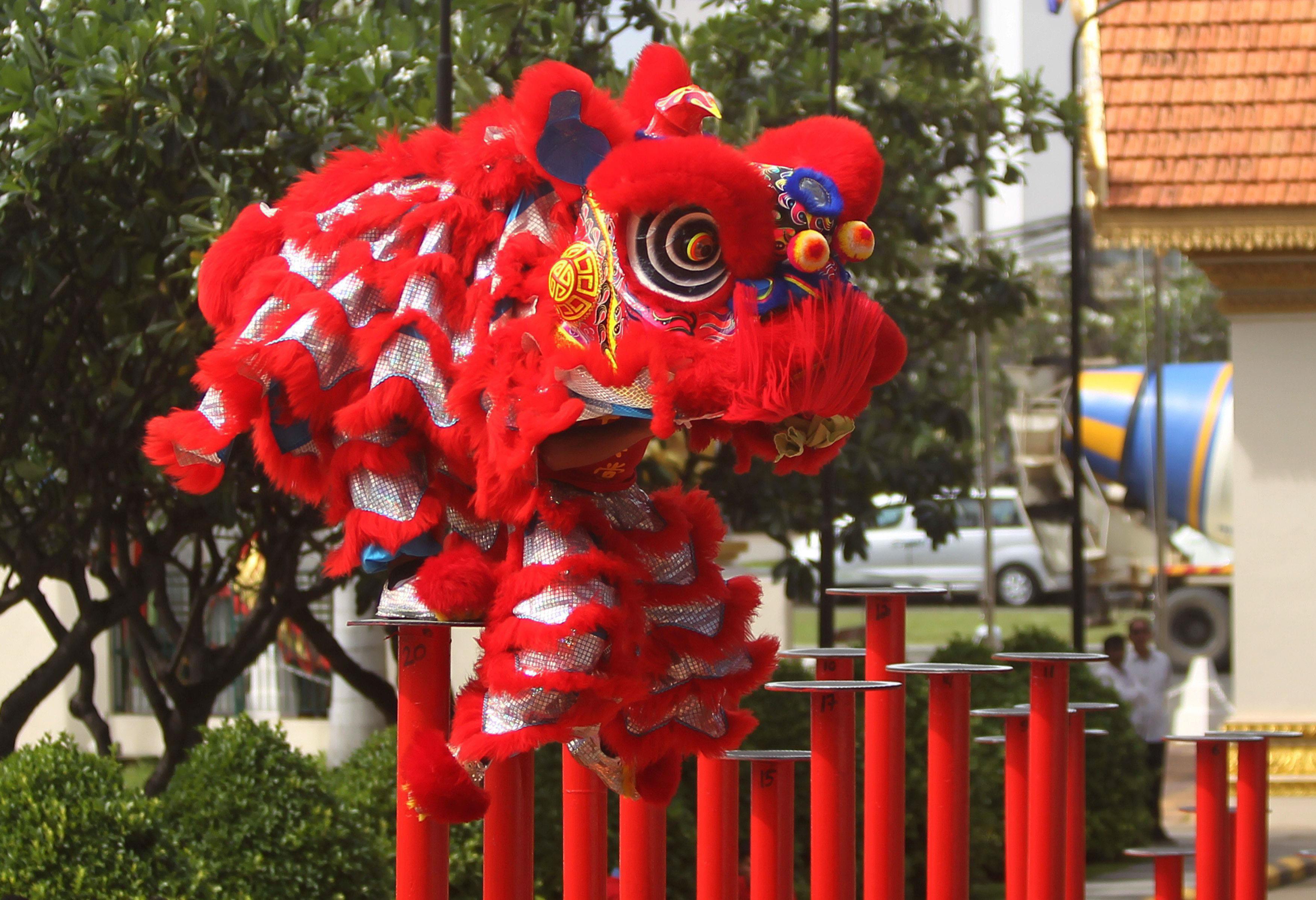 Men perform a lion dance ahead of the Chinese Lunar New Year in Phnom Penh