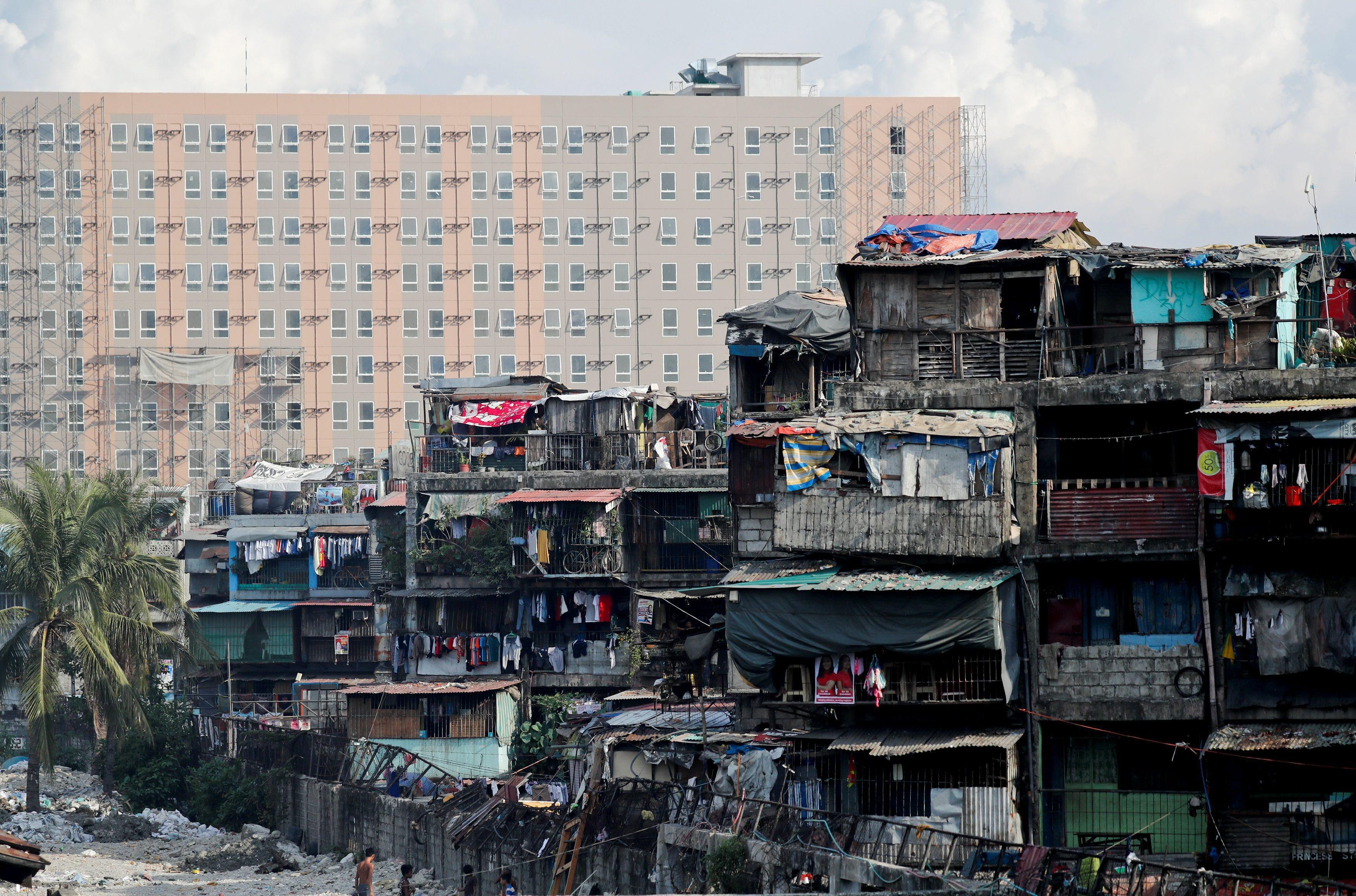 The Wider Image: Manila's slums an endless battle for firefighters