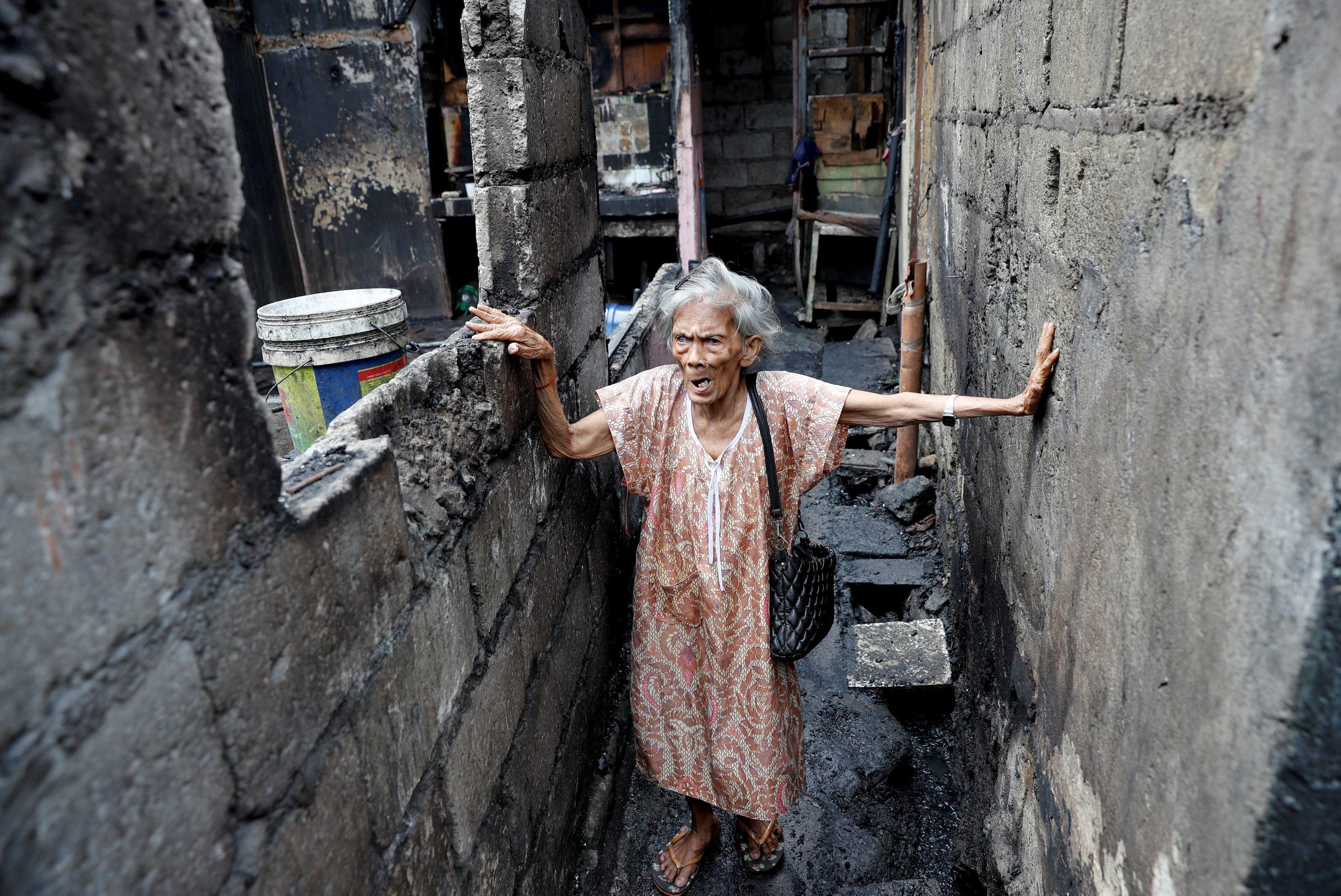 The Wider Image: Manila's slums an endless battle for firefighters