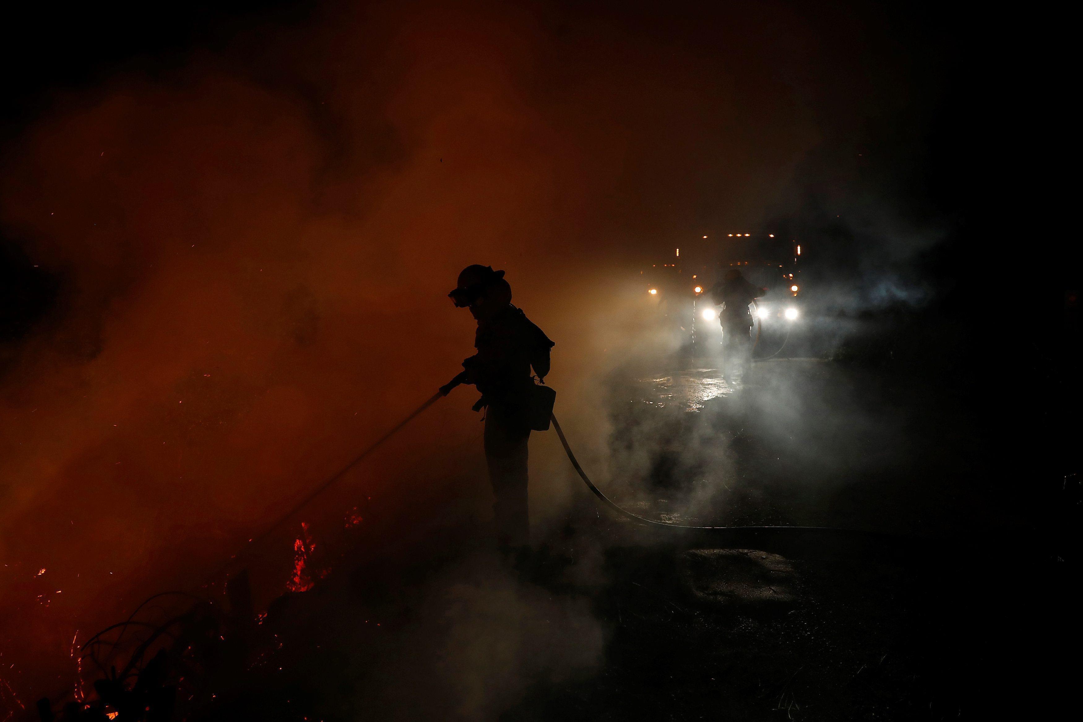 Firefighters battle the Loma Fire near Santa Cruz, California