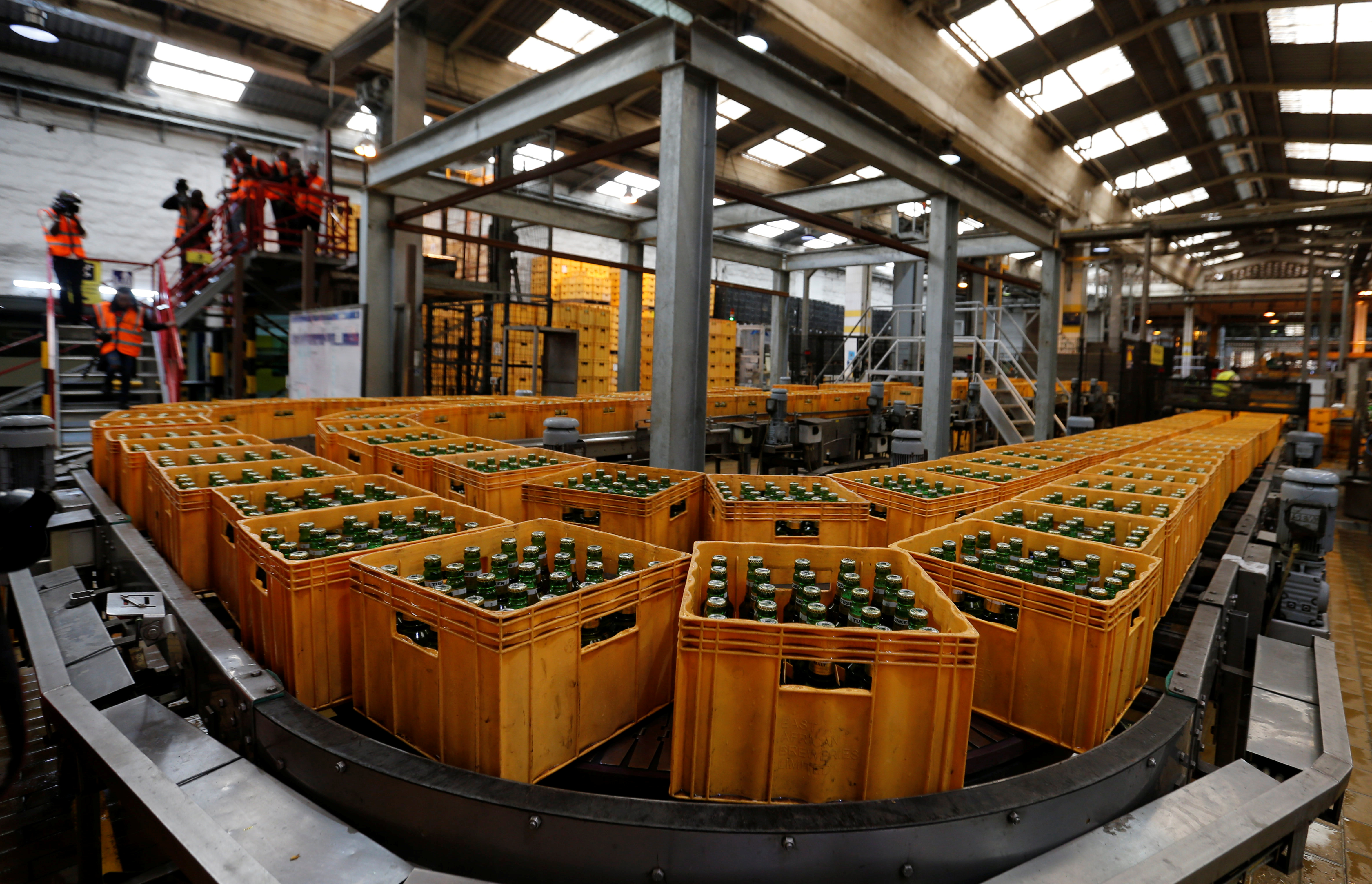 Crates of Tusker Malt beer are seen on a conveyor belt at the East African Breweries Limited factory in Ruaraka factory in Nairobi.
