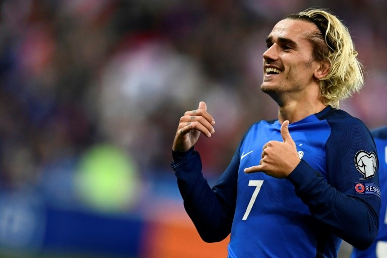 France's forward Antoine Griezmann celebrates after scoring a goal during the FIFA World Cup 2018 qualification football match against Belarus at the Stade de France October 10, 2017