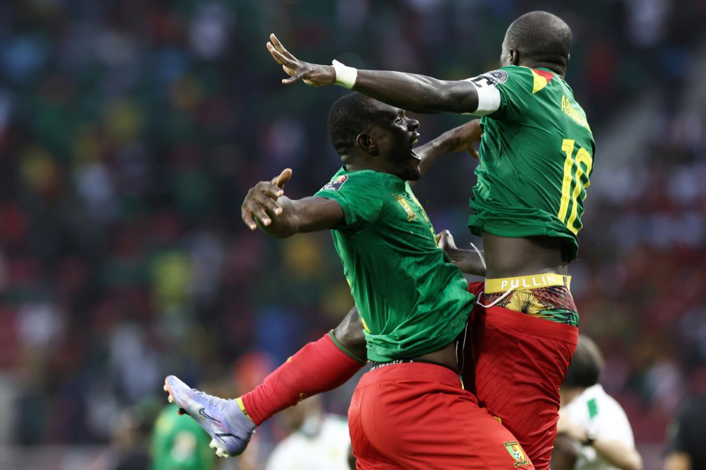 Hosts Cameroon light up Cup of Nations to qualify for knockout stages