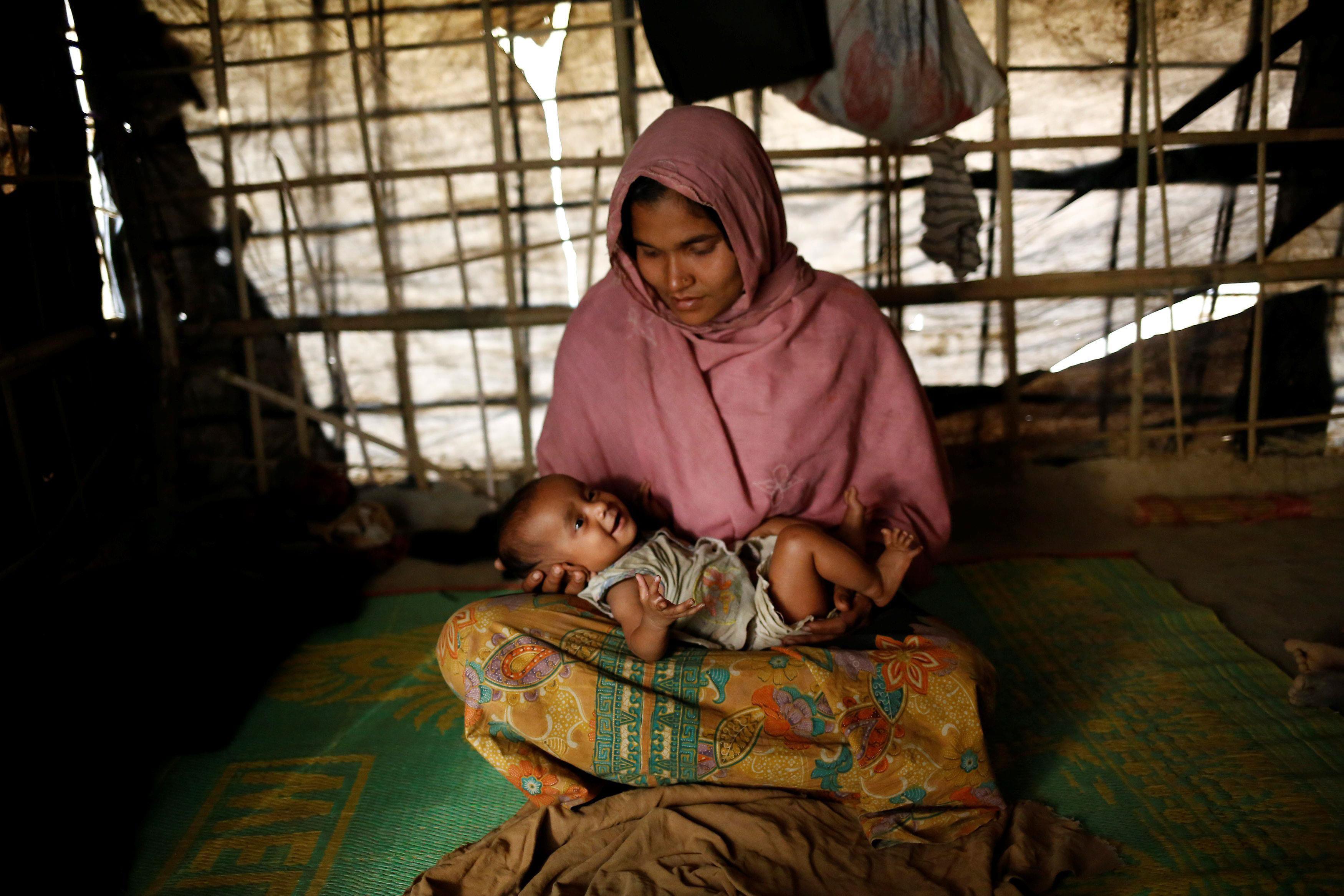 The Wider Image: Young Rohingya mothers flee persecution