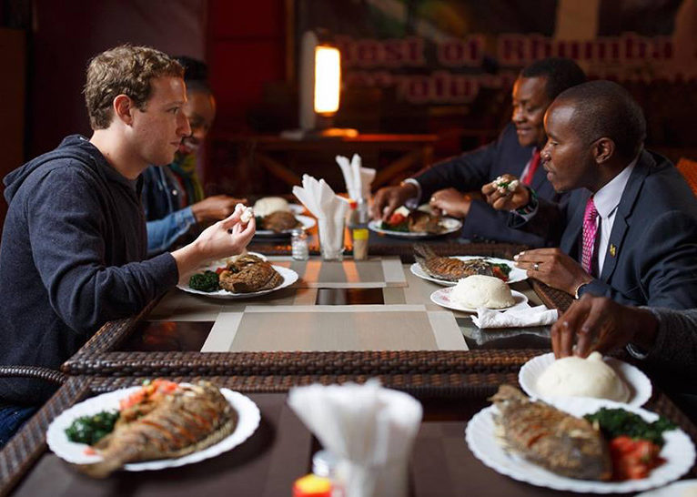 Facebook CEO Mark Zuckerberg enjoying a taste of Kenyan dishes.