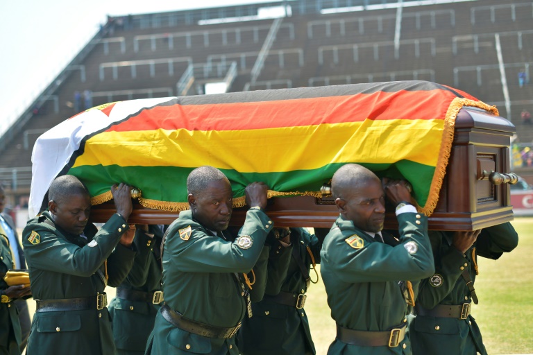 Soldiers carrying the casket bearing the remains of Robert Mugabe.