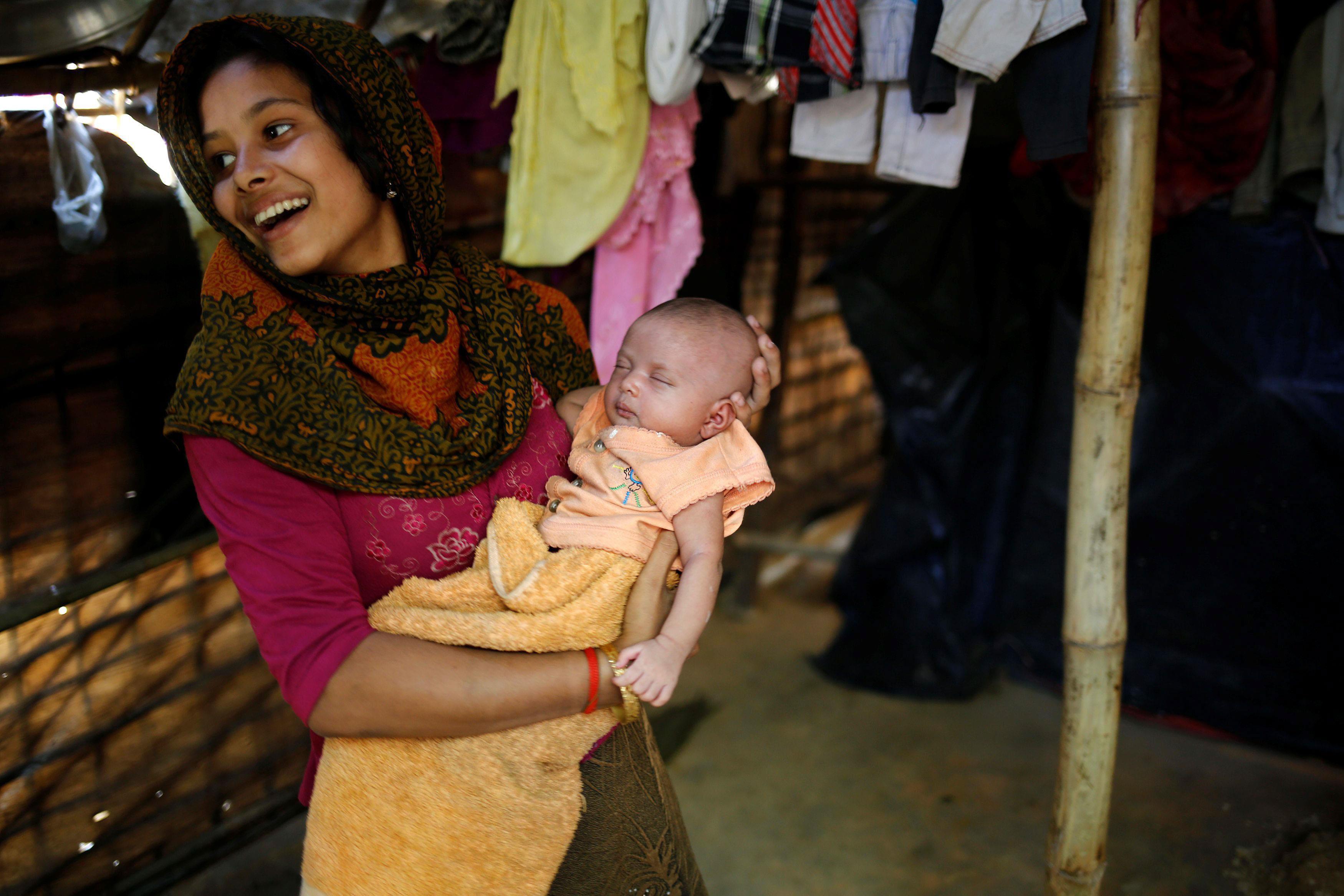 The Wider Image: Young Rohingya mothers flee persecution