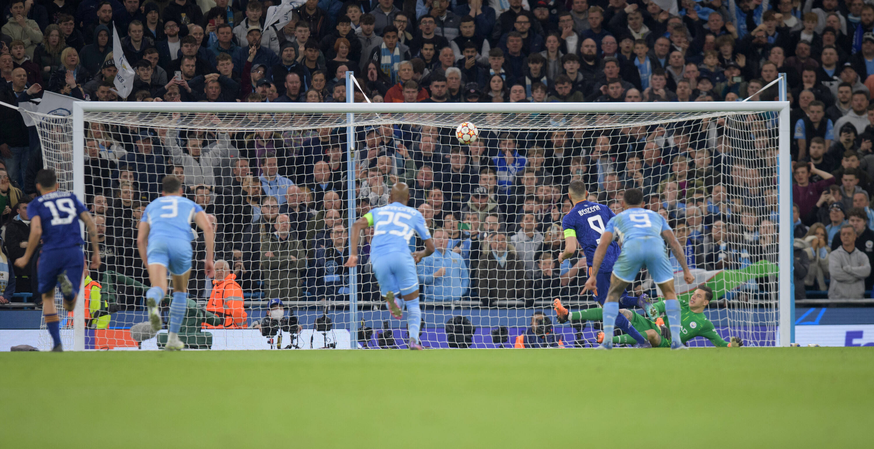Ederson watches as Karim Benzema's audacious chip enters the goal