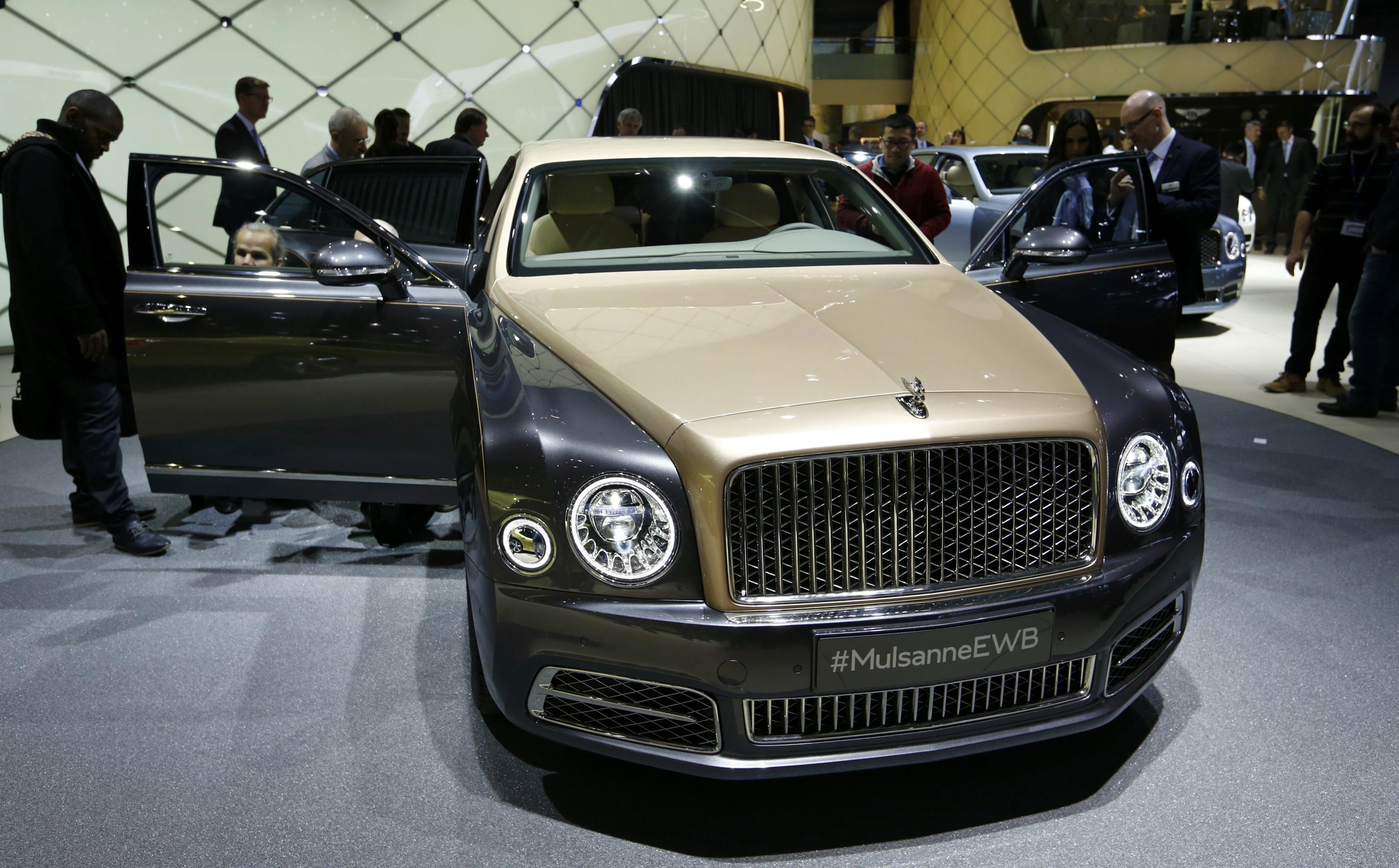 People look at the new Bentley Mulsanne EWB at the 86th International Motor Show in Geneva