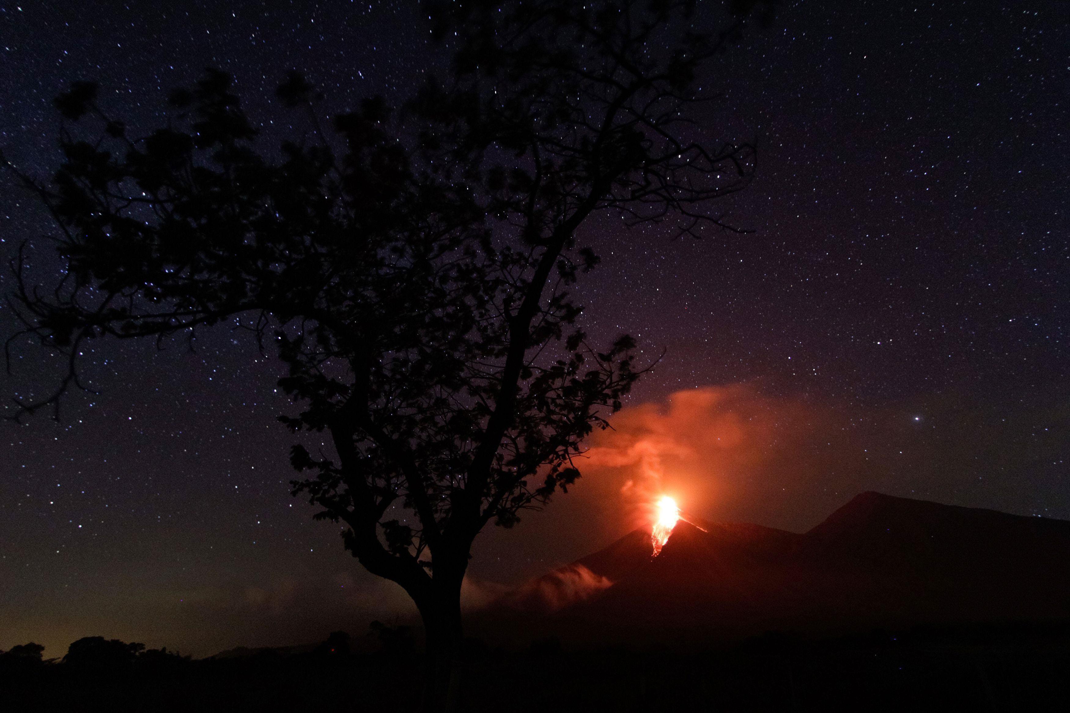Lava flows from Fuego volcano during an eruption as seen from Alotenango