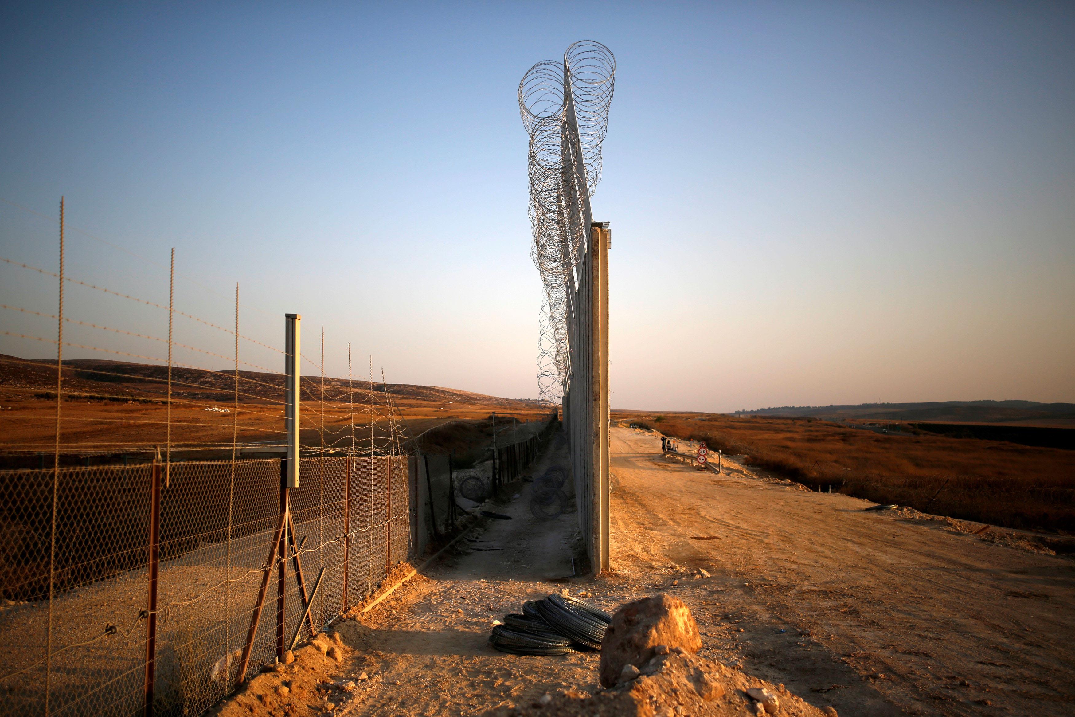 An Israeli barrier with the West Bank is seen while still under construction near Havat Ela in south