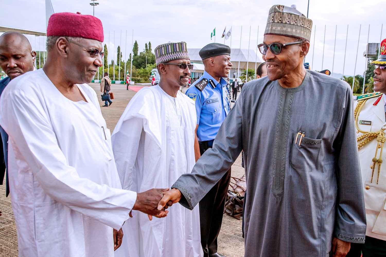 President Muhammadu Buhari shakes hands with his former Chief of Staff, late Abba Kyari [Presidency]