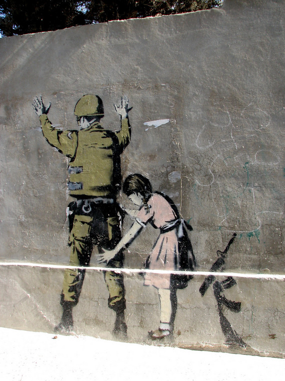 Banksy, graffiti w Betlejem, fot. welshkaren/flickr