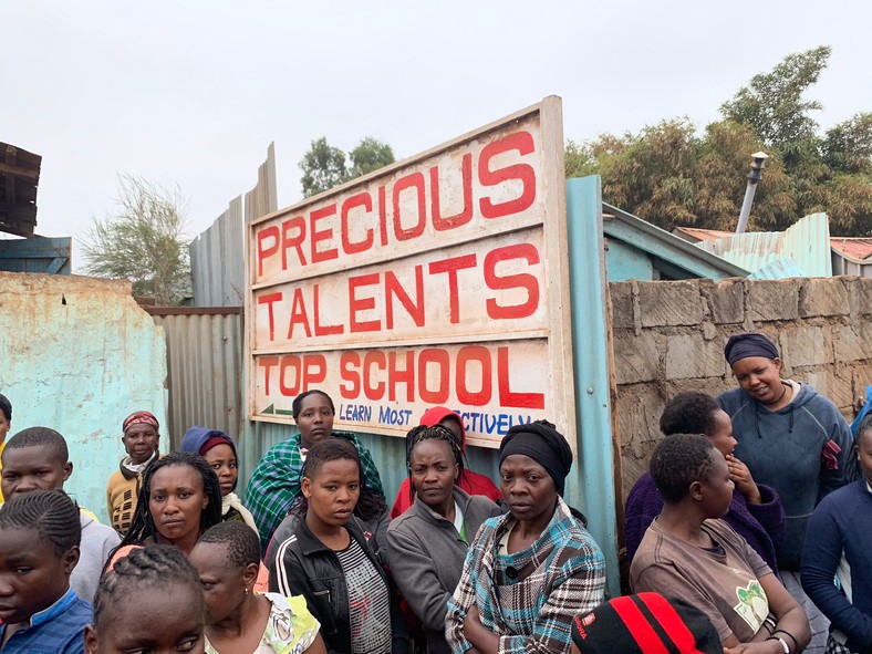 Onlookers on-site at Precious Talents School where 4 pupils were feared dead on Monday morning after building collapsed
