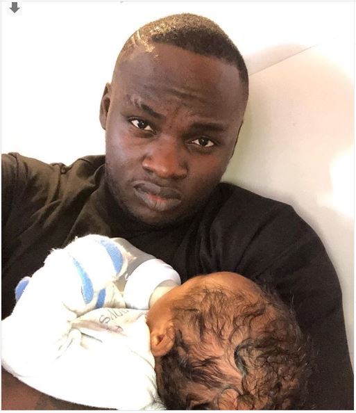Rapper Khaligraph Jones with his new Born Baby Amila 
