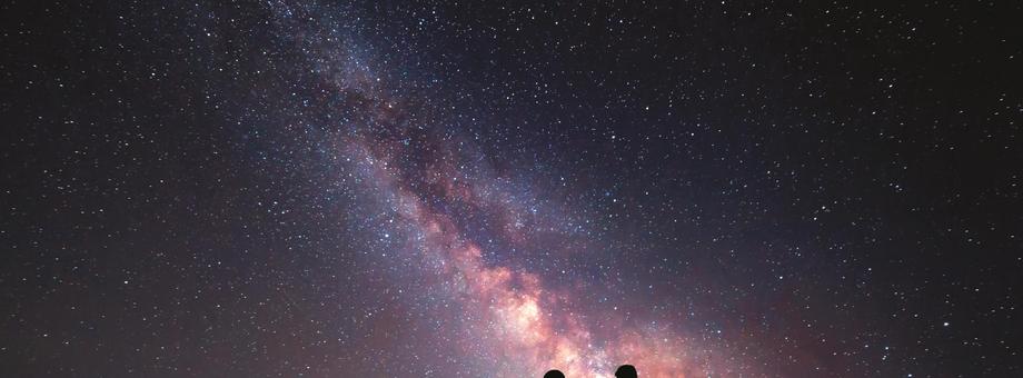 Milky Way. Night sky and silhouette of a family