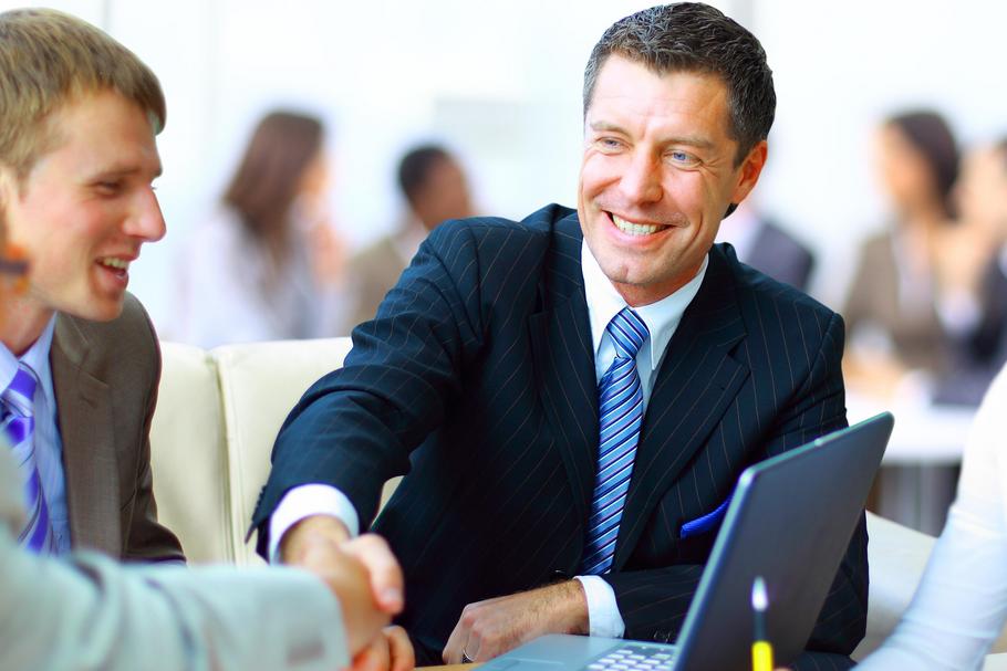 Business people shaking hands, finishing up a meeting