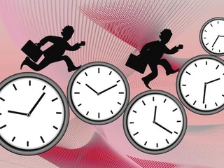 digital image of business people running on clocks