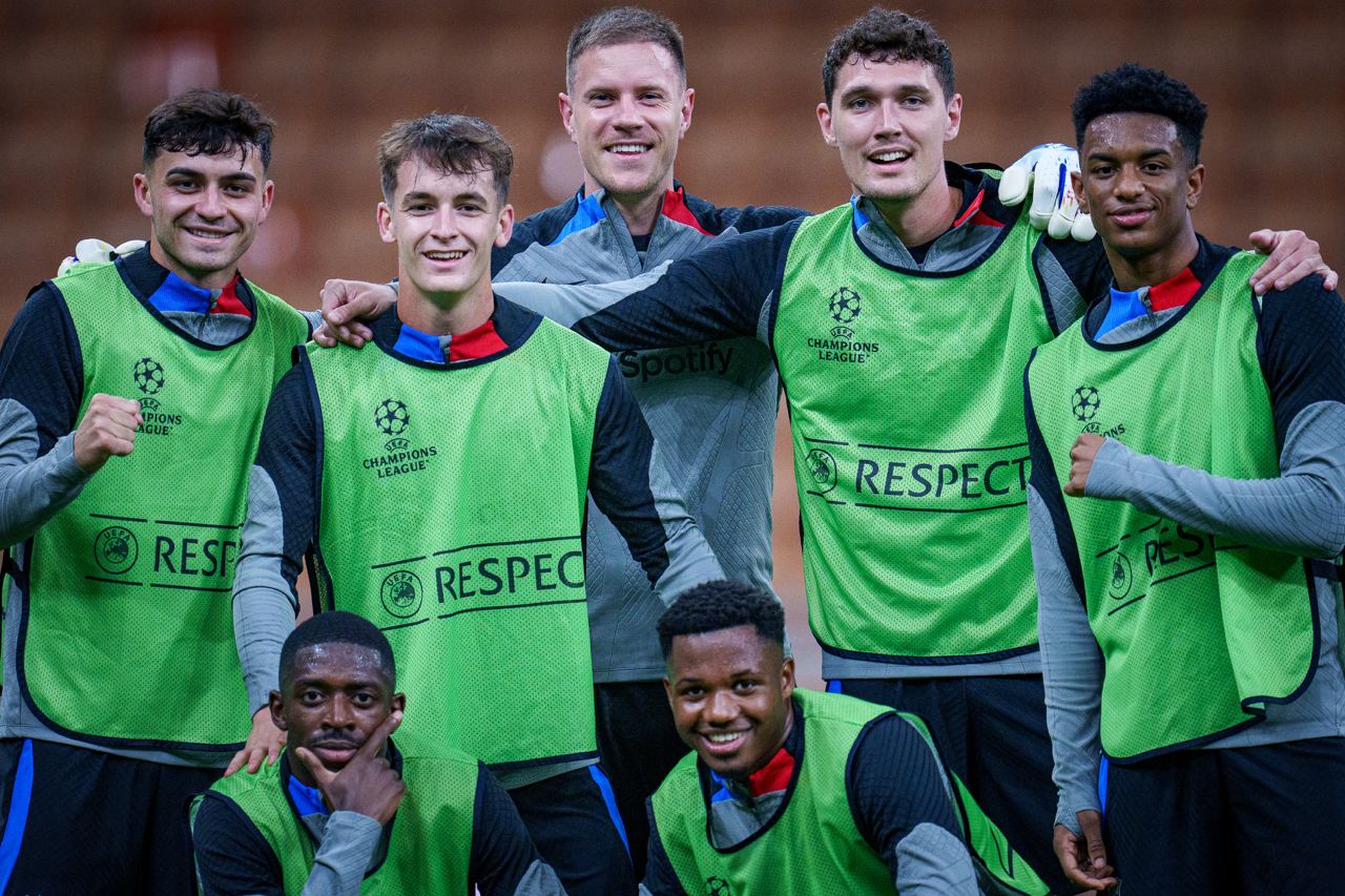 Barcelona superstars all smile in training, with Dembele (left, first row) wearing a different look.