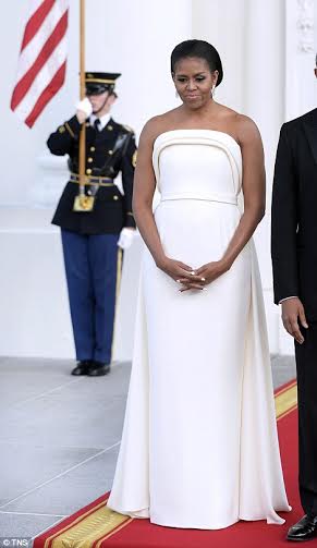 US First Lady glows in white gown for the State Dinner held in honour of  the Singaporean PM