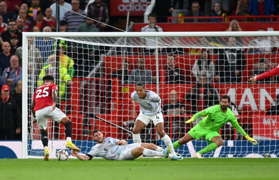 Virgil Van Djik took up a watching brief as Jadon Sancho dribbled past a sliding James Milner