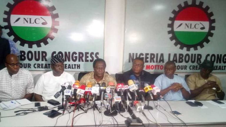 NLC President Ayuba Wabba (M) addressing a world press conference