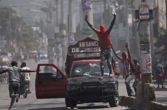 Violence rocked the streets of Haiti's Capital Port-Au-Prince with armed gangs taking on the police