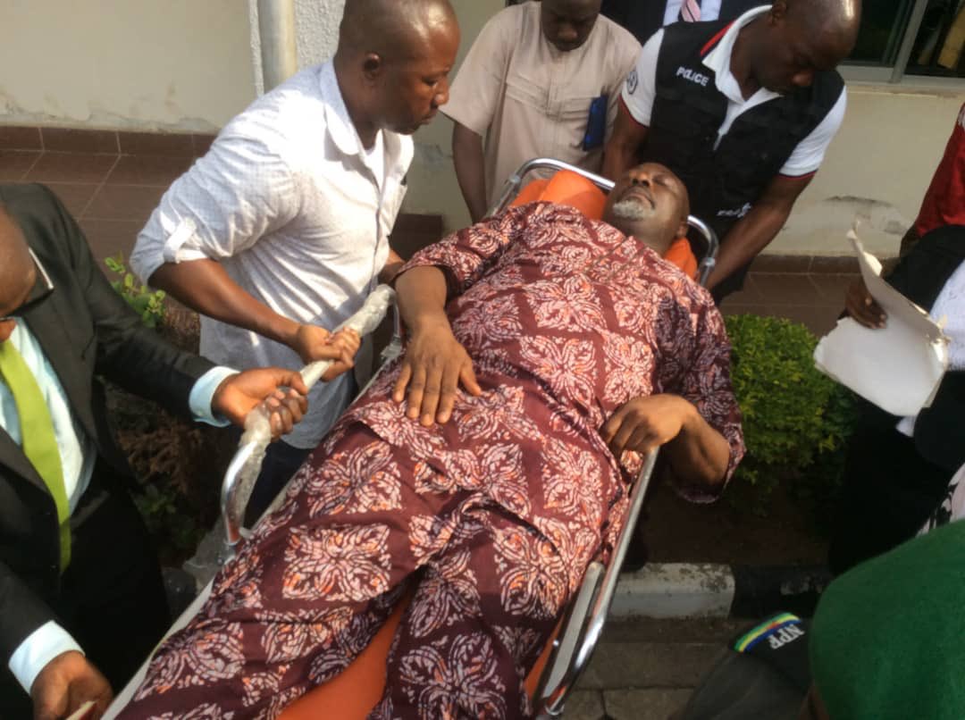 Senator Dino Melaye wheeled into an Abuja Magistrate Court on a stretcher. (Punch)