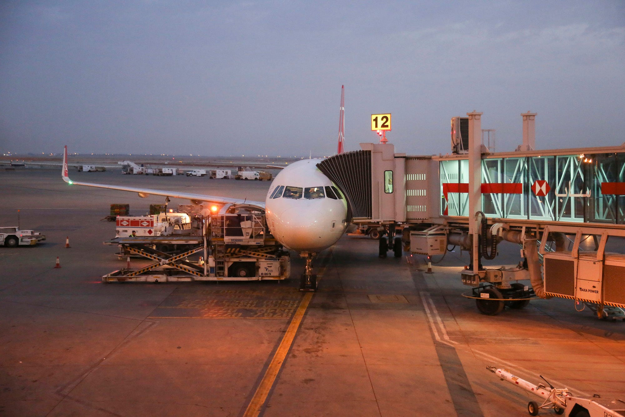 A plane waits at the gate at King Khalid International Airport in Riyadh, in Saudi Arabia.NurPhoto / Contributor / Getty