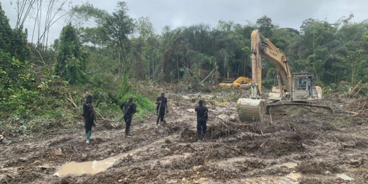 Police recover missing excavator; Ellembelle DCE, three others arrested for obstruction