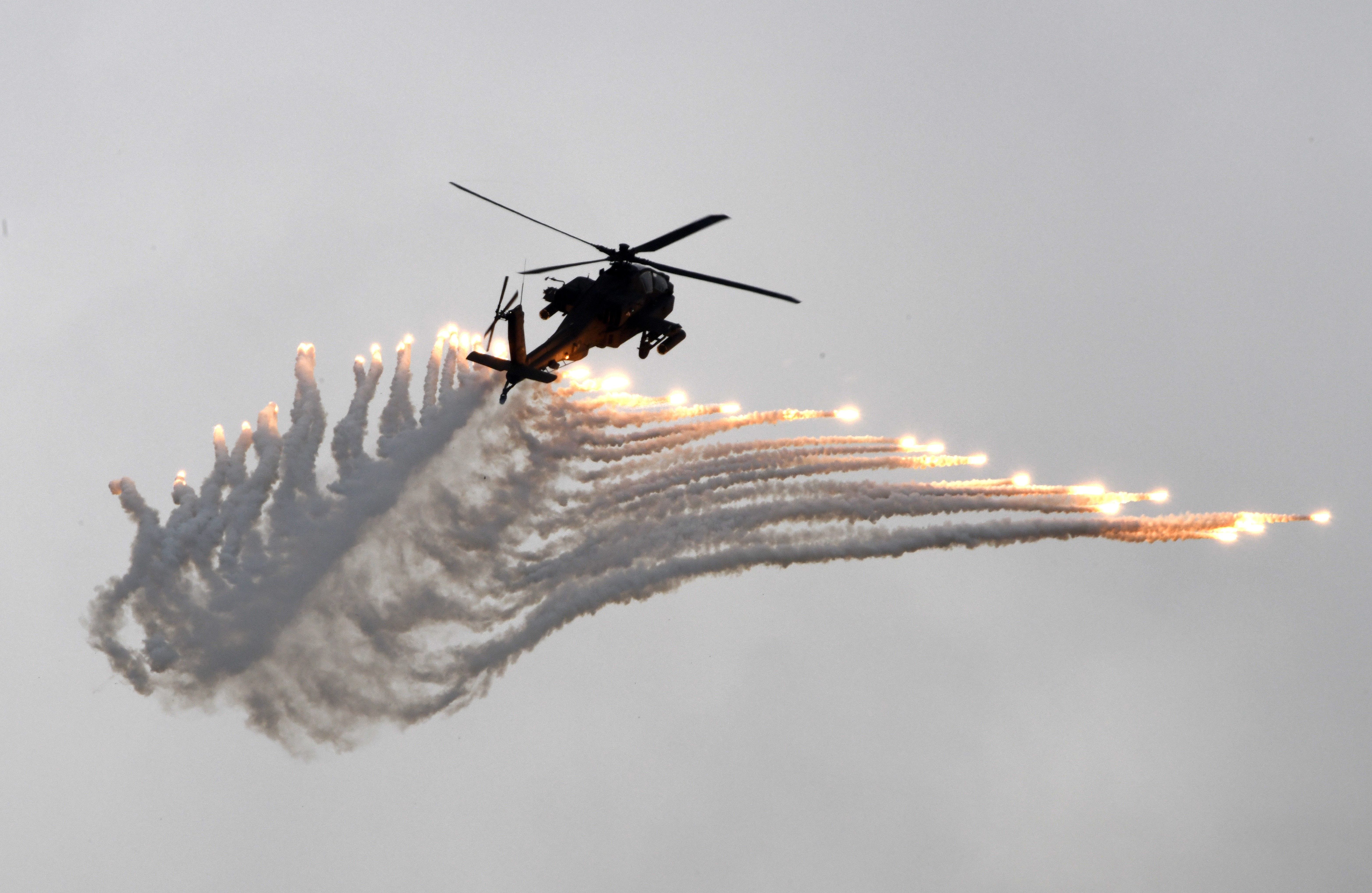 An AH-64 Apache attack helicopter releases flares during the Han Kuang drill at the Ching Chuan Kang (CCK) air force base in Taichung, central Taiwan, on June 7, 2018.SAM YEH/AFP via Getty Images