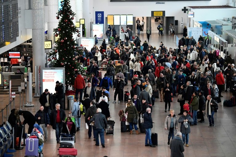 Airport arrival scene showing a traveler navigating with a smartphone immediately after landing