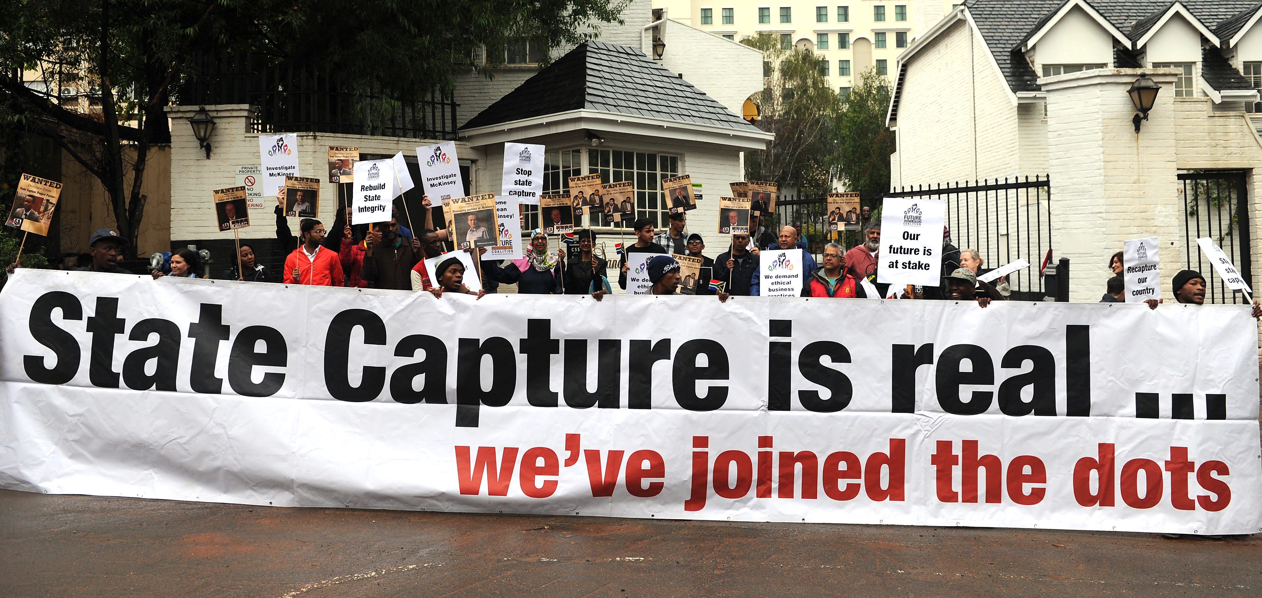 A civil society group protesting McKinsey's business dealings with Eskom outside the firm's offices in Sandton, South Africa, in October 2017.Felix Dlangamandla/Foto24/Gallo Images/Getty Images