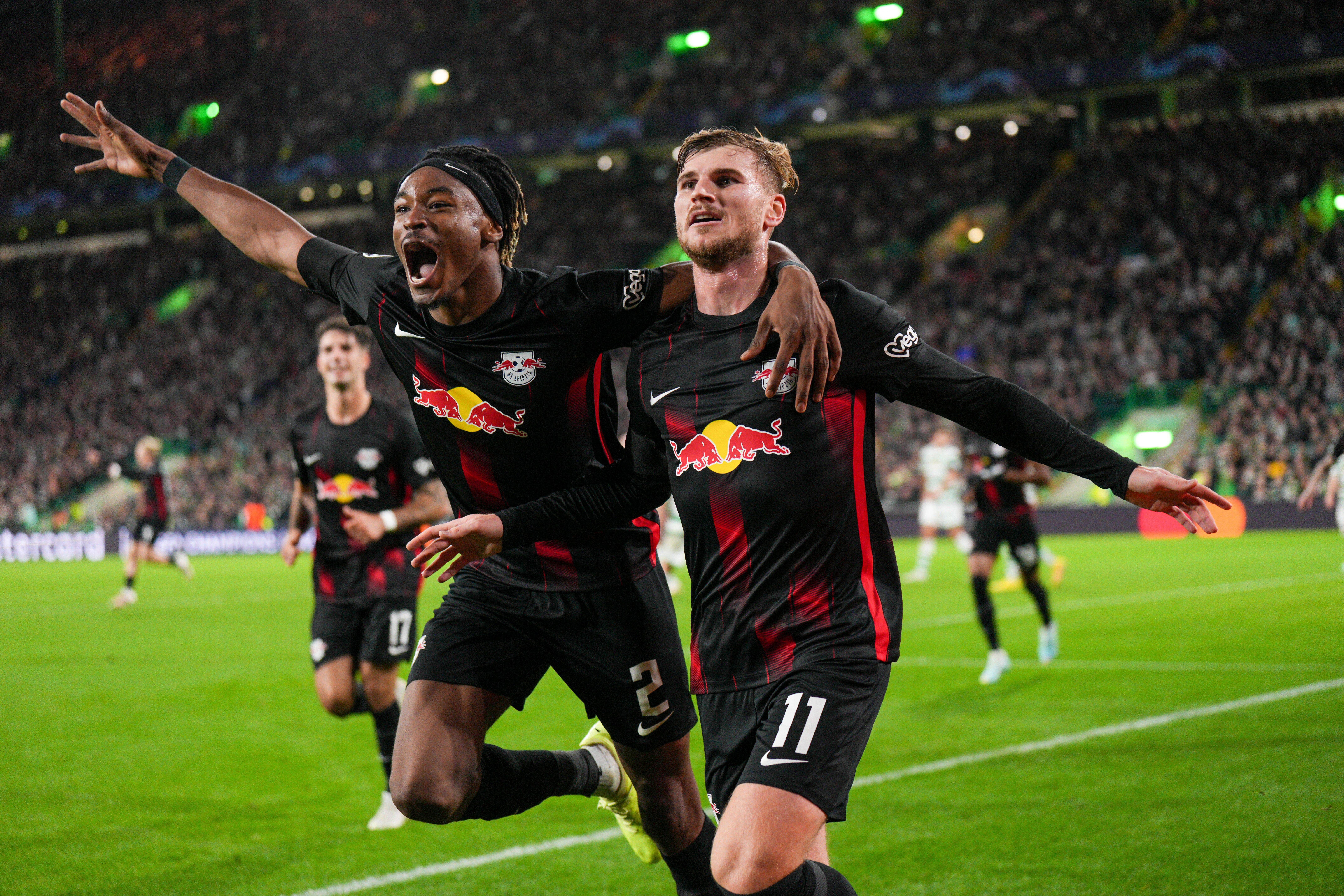 Timo Werner of RB Leipzig celebrates with team mate Mohamed Simakan after scoring to give Leipzig a 0-1 lead against Celtic on October 11, 2022.