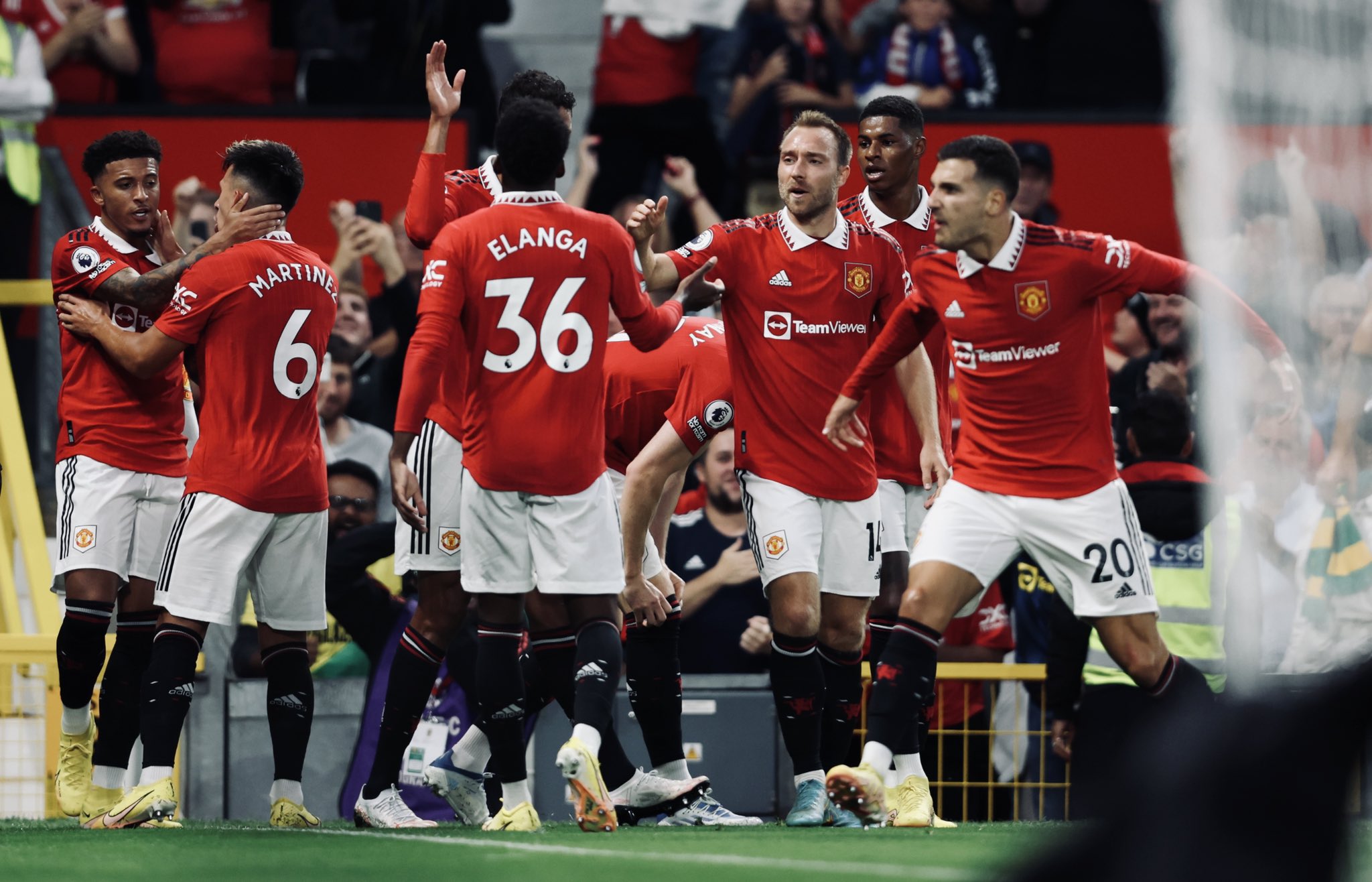 Manchester United celebrate their first Premier League victory of the season